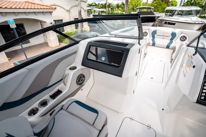 Slide: The Image of 2025 Hurricane SunDeck 2600 OB interior, featuring sleek seating and modern design elements. - 23