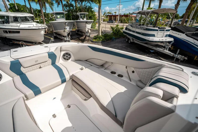 Slide: The Image of 2025 Hurricane SunDeck 2600 OB boat interior with luxurious seating and modern design. - 28