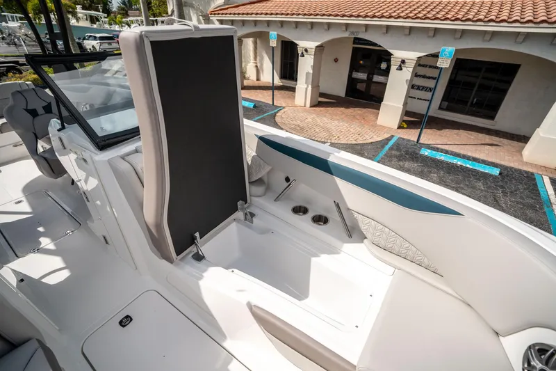Slide: The Image of 2025 Hurricane SunDeck 2600 OB boat interior with seating and cup holders. - 29