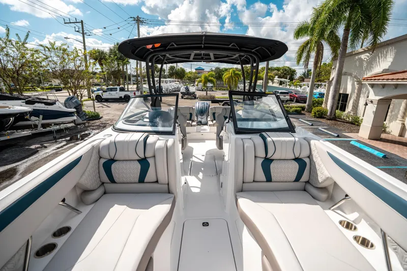 Slide: The Image of 2025 Hurricane SunDeck 2600 OB boat interior with plush seating and modern design. - 33
