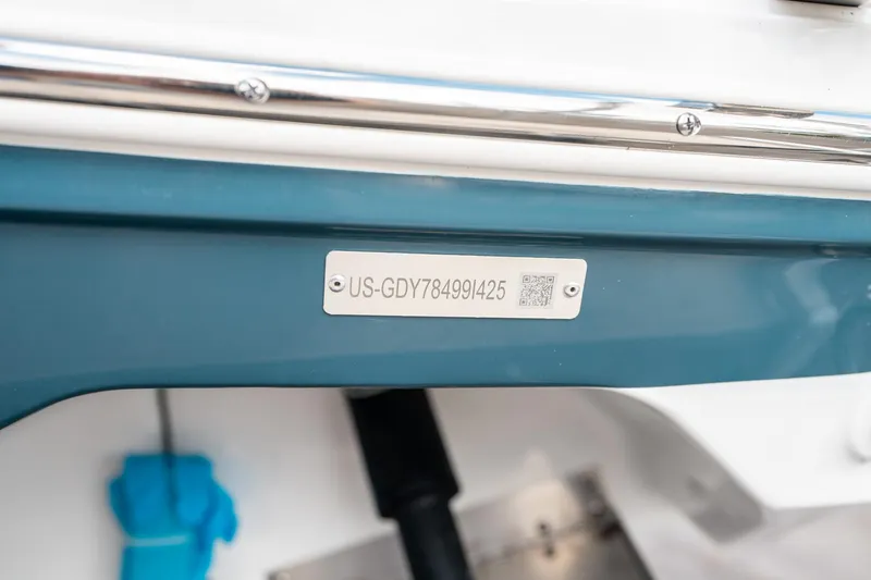 Slide: The Image of 2025 Hurricane SunDeck 2600 OB boat identification plate with serial number and QR code. - 36