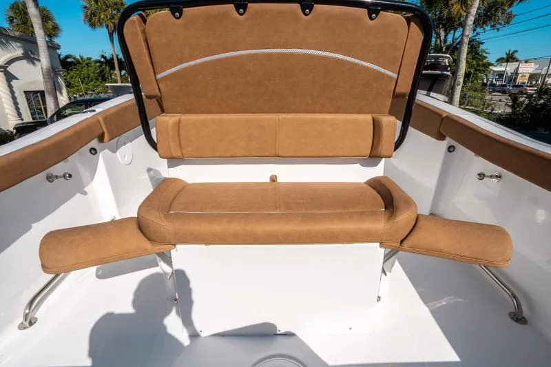 Slide: The Image of 2025 Sea Hunt Ultra 255 SE boat seating with tan upholstery and sleek design. - 16
