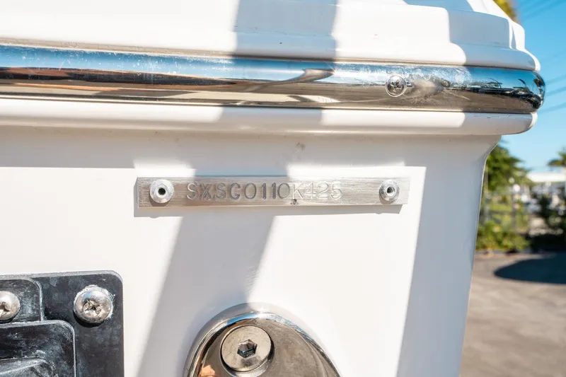 Slide: The Image of 2025 Sea Hunt Ultra 255 SE boat hull identification number plate. - 44