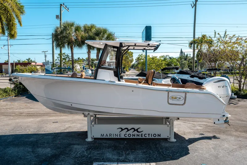 Slide: The Image of 2025 Sea Hunt Ultra 255 SE boat displayed at Marine Connection dealership. - 5
