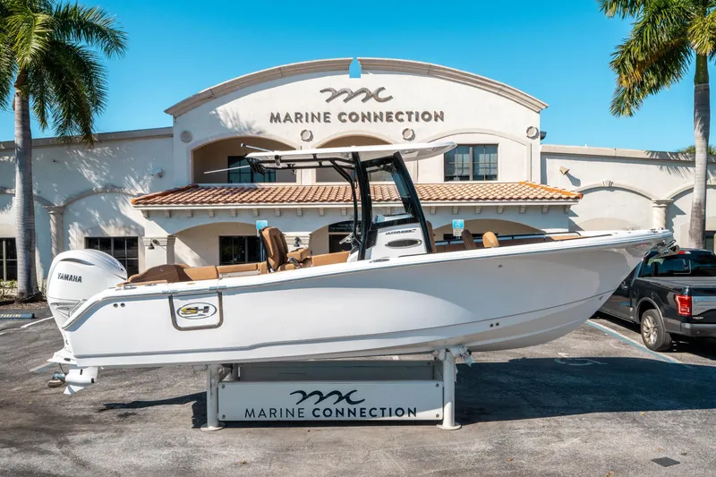 Slide: The Image of 2025 Sea Hunt Ultra 255 SE boat displayed at Marine Connection dealership. - 1