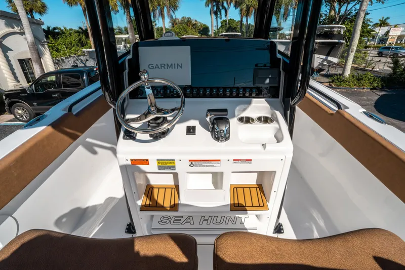 Slide: The Image of 2025 Sea Hunt Ultra 255 SE boat console with Garmin navigation system. - 23