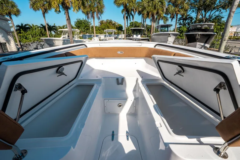 Slide: The Image of 2025 Sea Hunt Ultra 255 SE boat interior with open storage compartments. - 37