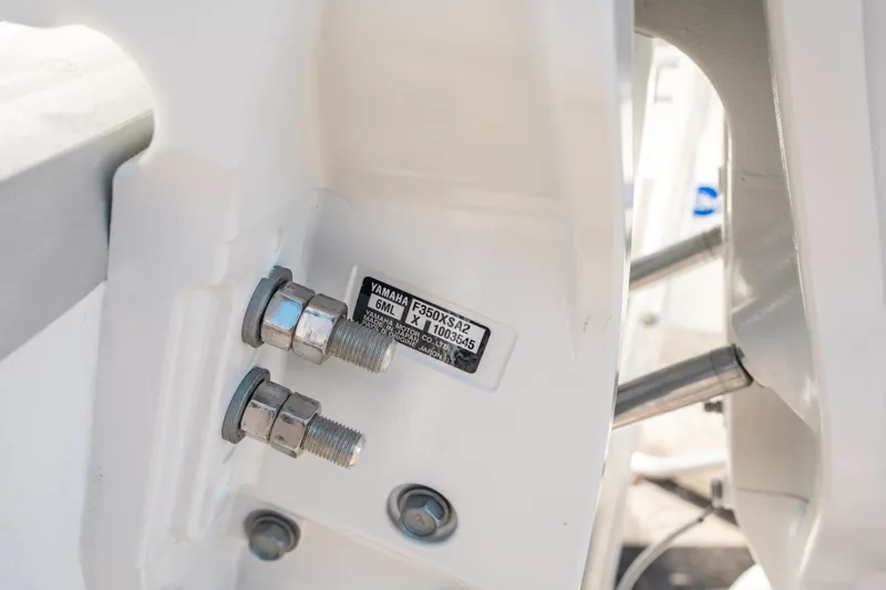 Slide: The Image of Close-up of Yamaha engine bolts on 2025 Sea Hunt Ultra 255 SE boat. - 43