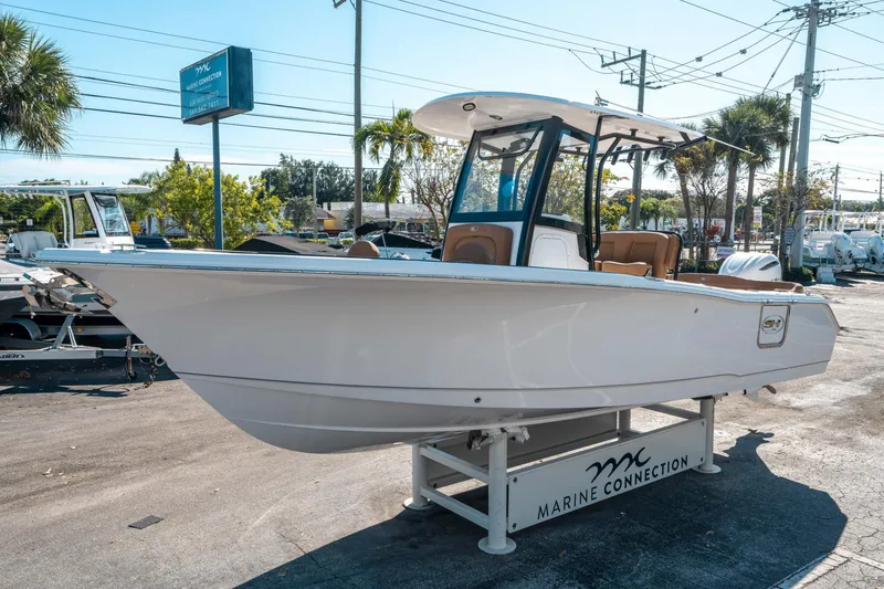 Slide: The Image of 2025 Sea Hunt Ultra 255 SE boat displayed at Marine Connection dealership. - 6