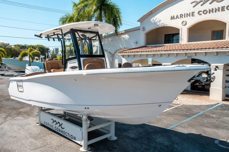 Slide: The Image of 2025 Sea Hunt Ultra 255 SE boat displayed at Marine Connection dealership. - 8