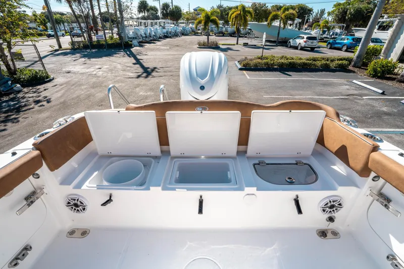 Slide: The Image of 2025 Sea Hunt Ultra 255 SE boat interior with open storage compartments. - 14