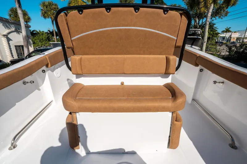 Slide: The Image of 2025 Sea Hunt Ultra 255 SE boat interior with tan seating and stainless steel accents. - 15