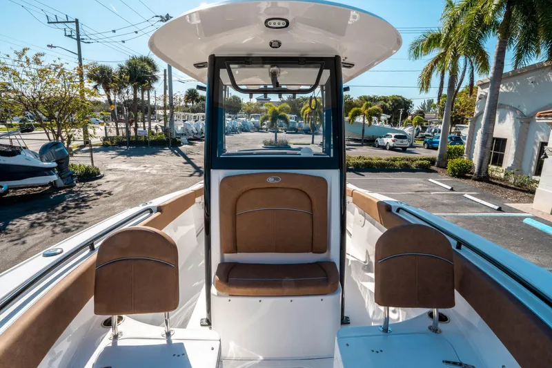 Slide: The Image of 2025 Sea Hunt Ultra 255 SE boat interior with brown seating and modern design. - 35