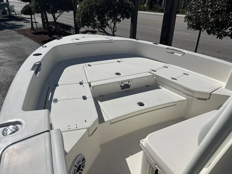 Slide: The Image of 2025 Pathfinder 2400 TRS boat interior with storage compartments and seating. - 15