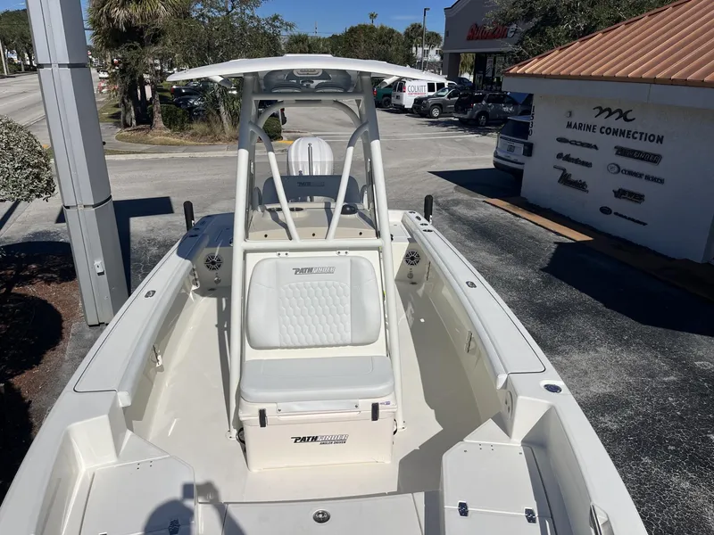 Slide: The Image of 2025 Pathfinder 2400 TRS boat at Marine Connection dealership, showcasing sleek design and seating. - 18