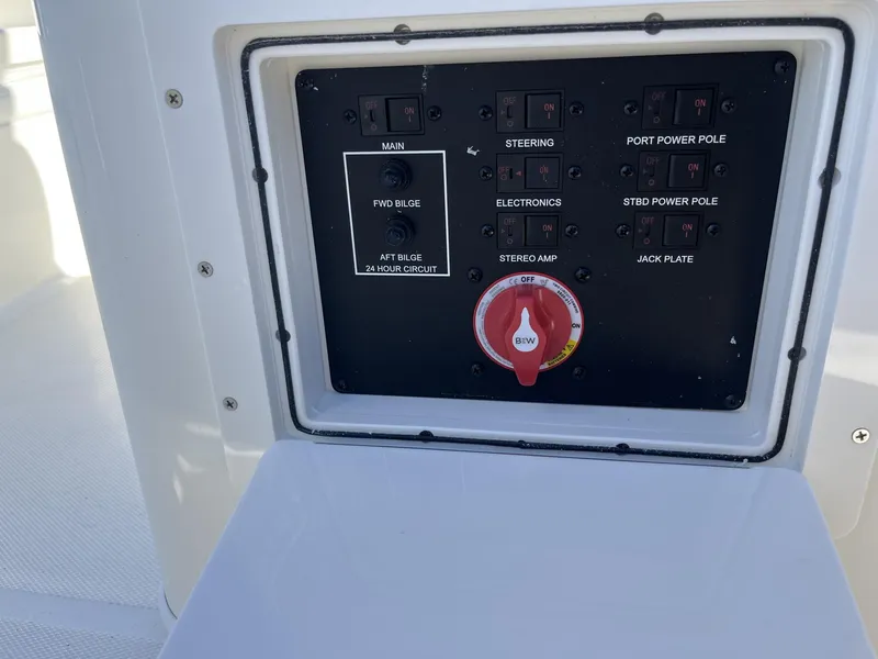 Slide: The Image of Control panel of 2025 Pathfinder 2400 TRS boat with switches and main power dial. - 24