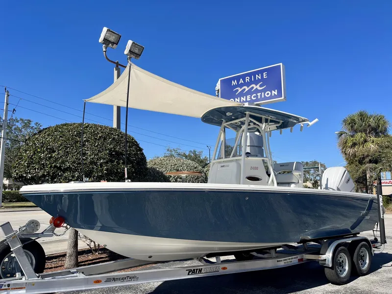 Slide: The Image of 2025 Pathfinder 2400 TRS boat on trailer at Marine Connection dealership. - 34