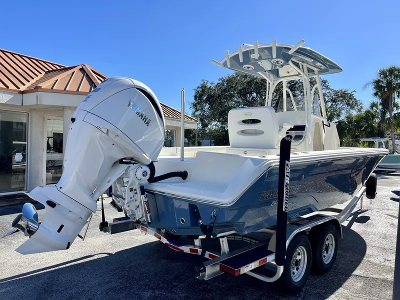 Slide: The Image of 2025 Pathfinder 2400 TRS boat with Yamaha engine on trailer, sunny day. - 6