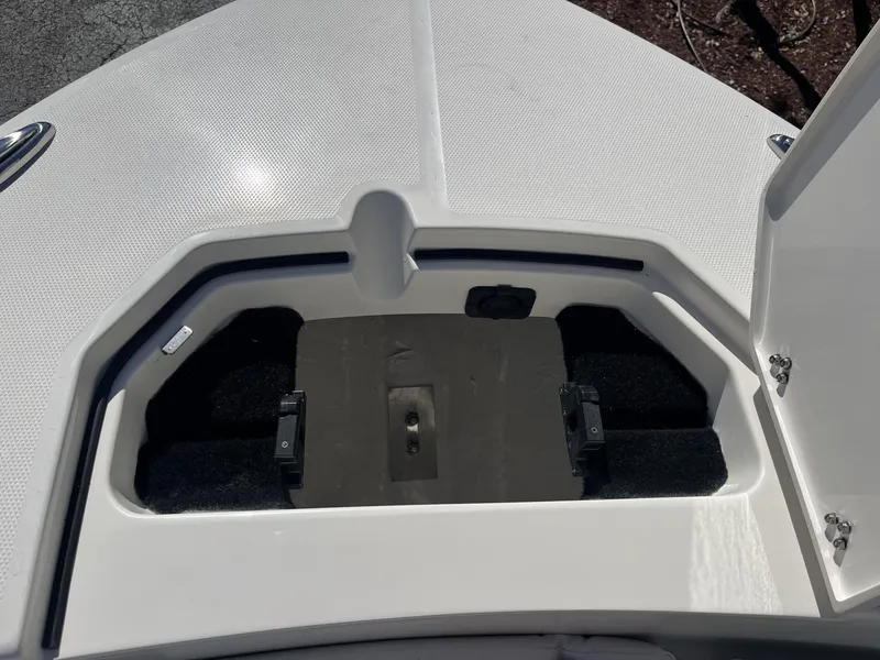 Slide: The Image of Open storage compartment on 2025 Pathfinder 2400 TRS boat deck. - 17
