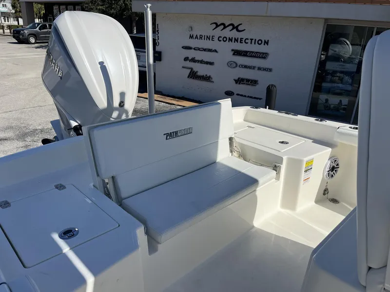 Slide: The Image of 2025 Pathfinder 2400 TRS boat interior with seating and Yamaha engine at Marine Connection. - 28