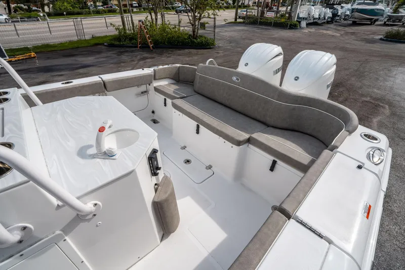 Slide: The Image of 2025 Sea Hunt Ultra 275 SE boat interior with seating and dual engines. - 11