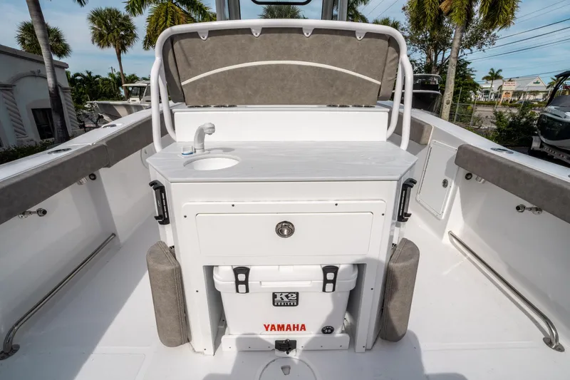 Slide: The Image of 2025 Sea Hunt Ultra 275 SE boat interior with sink and storage. - 15
