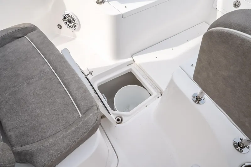 Slide: The Image of Interior of 2025 Sea Hunt Ultra 275 SE boat, featuring seating and storage compartment. - 40
