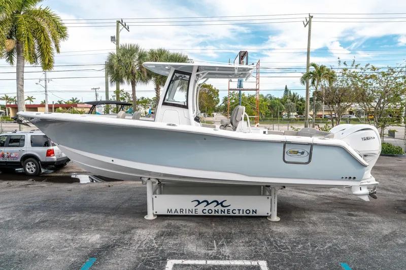 Slide: The Image of 2025 Sea Hunt Ultra 275 SE boat displayed at Marine Connection dealership. - 5