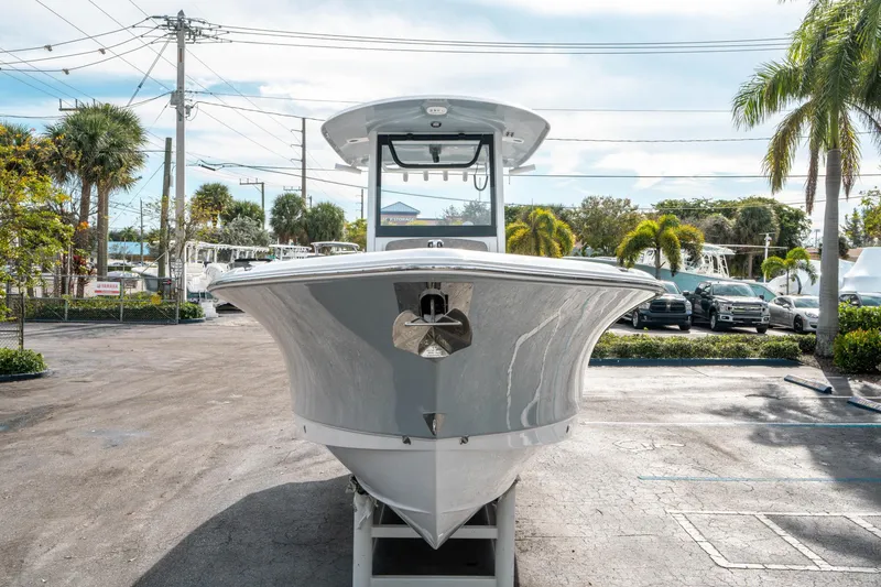 Slide: The Image of 2025 Sea Hunt Ultra 275 SE boat displayed outdoors, front view. - 7