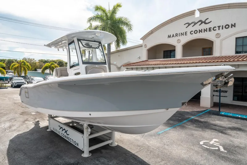 Slide: The Image of 2025 Sea Hunt Ultra 275 SE boat displayed at Marine Connection dealership. - 8