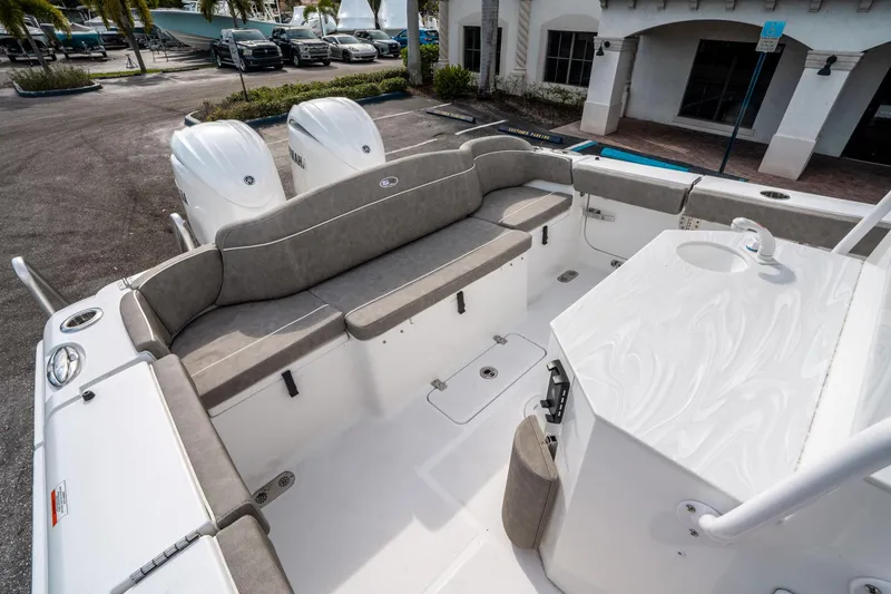 Slide: The Image of 2025 Sea Hunt Ultra 275 SE boat interior with seating and dual engines. - 12