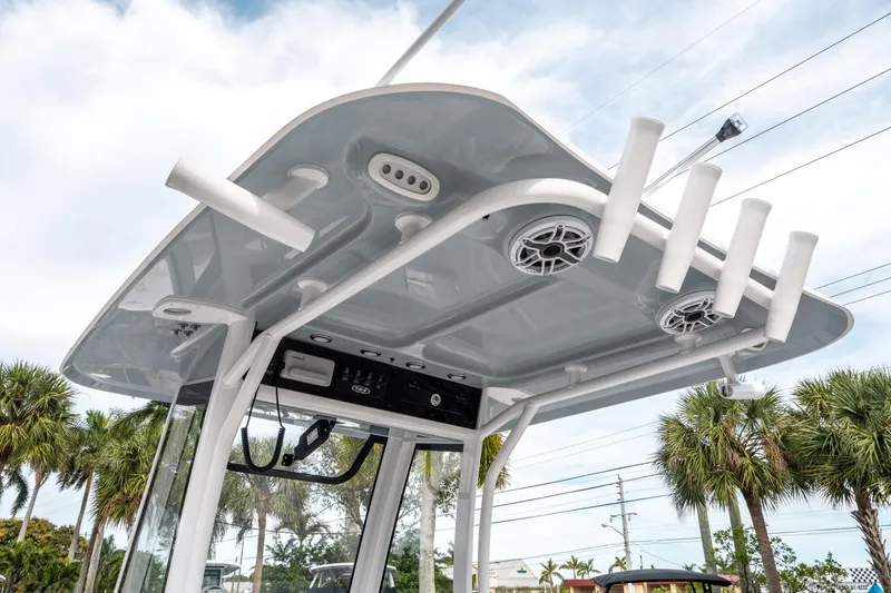 Slide: The Image of 2025 Sea Hunt Ultra 275 SE boat top with rod holders and speakers. - 19