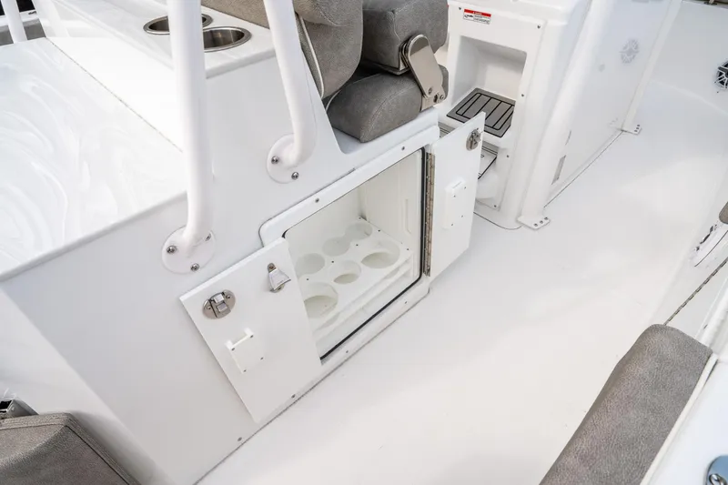 Slide: The Image of 2025 Sea Hunt Ultra 275 SE boat interior with open storage compartment. - 24