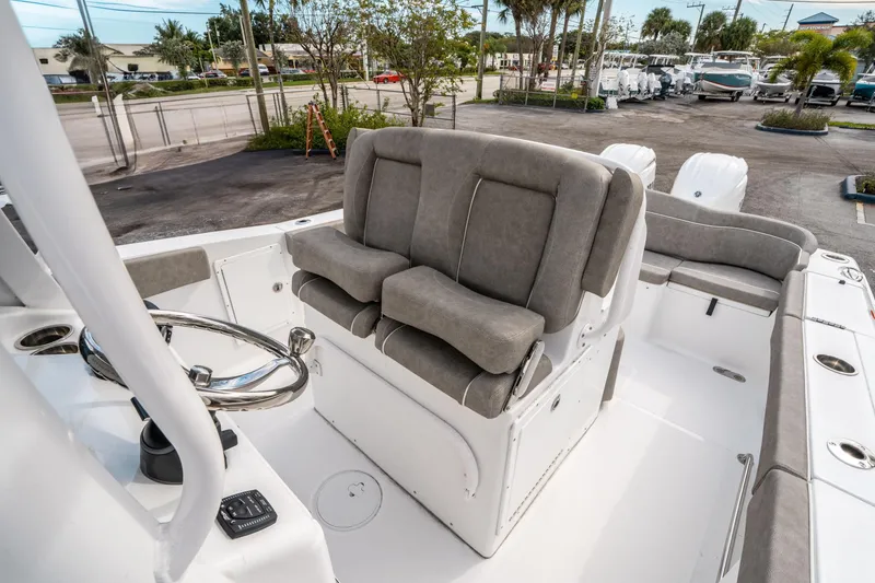 Slide: The Image of Interior of 2025 Sea Hunt Ultra 275 SE boat with plush seating and steering wheel. - 27