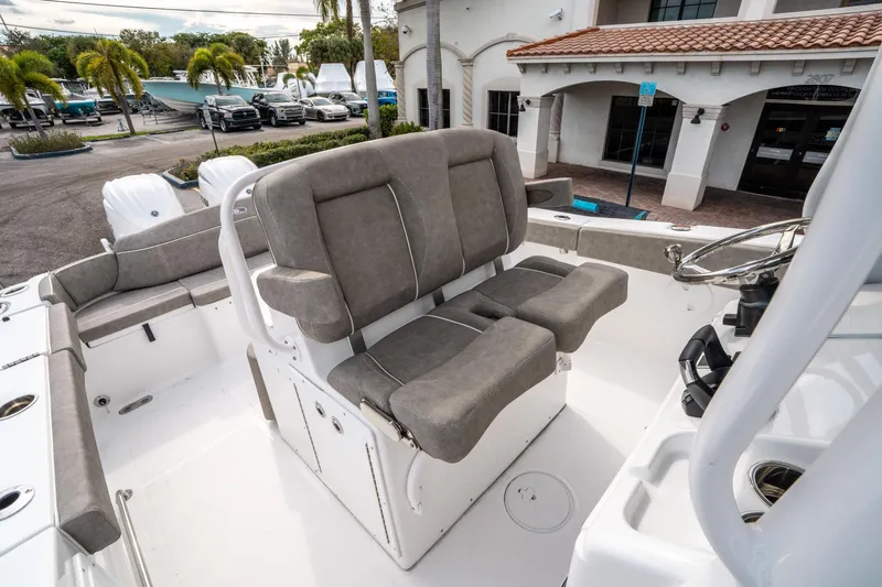 Slide: The Image of 2025 Sea Hunt Ultra 275 SE boat interior with dual seating and steering console. - 29