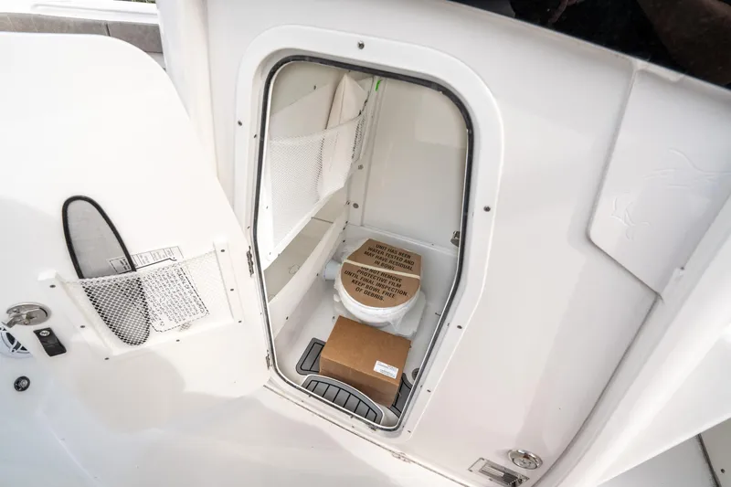 Slide: The Image of Storage compartment on 2025 Sea Hunt Ultra 275 SE boat, featuring organized interior space. - 31