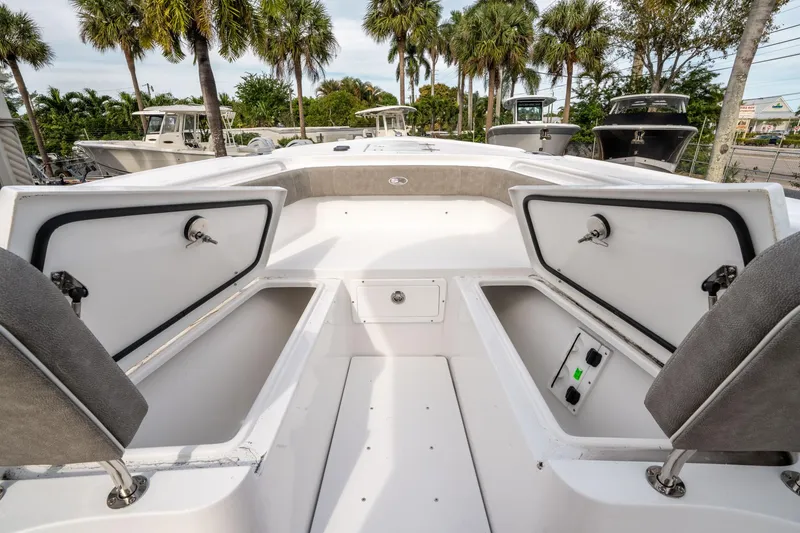 Slide: The Image of 2025 Sea Hunt Ultra 275 SE boat interior with open storage compartments and seating. - 39