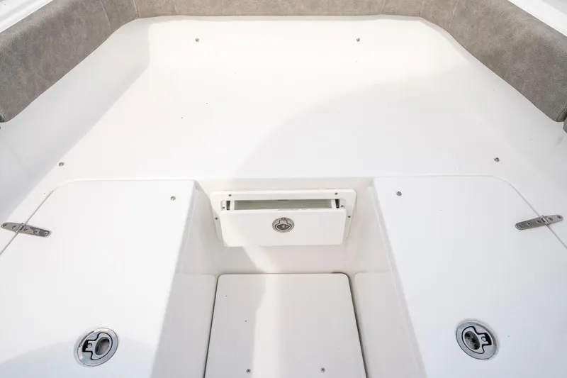 Slide: The Image of 2025 Sea Hunt Ultra 275 SE boat interior, featuring spacious seating and storage compartments. - 41