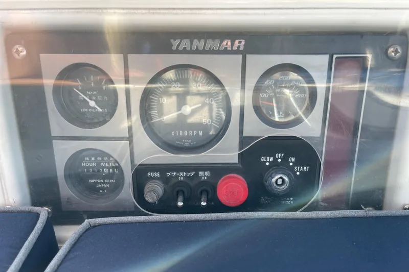 Slide: The Image of Control panel of a 1998 Hunter Passage 42 sailboat with Yanmar engine gauges. - 23