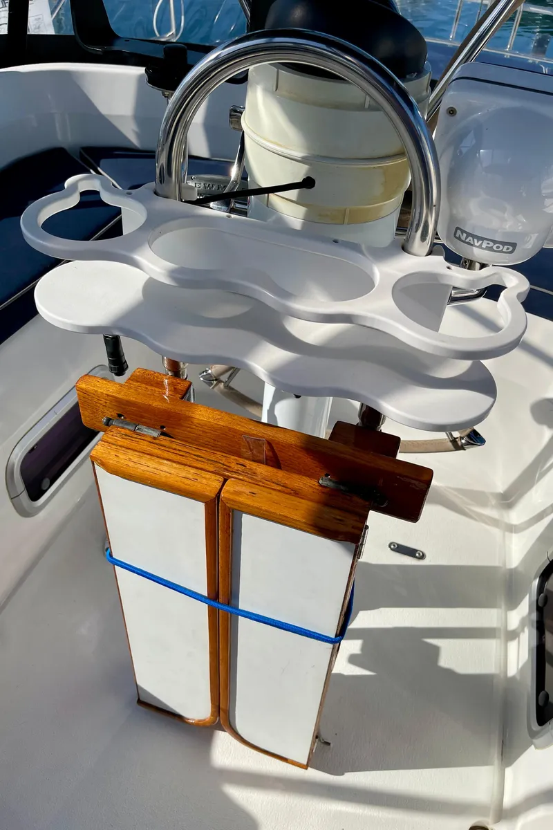 Slide: The Image of Cockpit of 1998 Hunter Passage 42 sailboat with wooden and white plastic fixtures. - 29