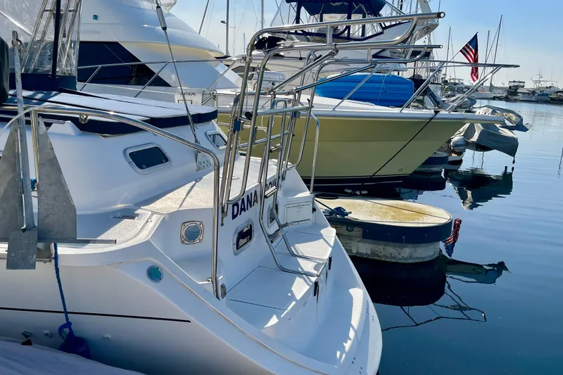 Slide: The Image of Hunter Passage 42 sailboat, 1998 model, docked in a marina with other boats. - 5