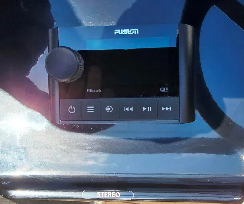 Slide: The Image of Fusion stereo system on 2025 Sea Ray SPX 210 BR boat dashboard. - 13