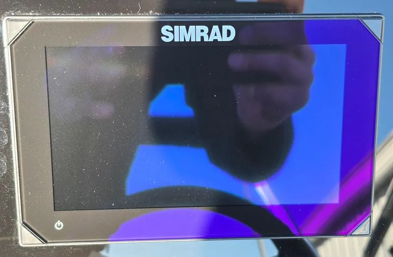Slide: The Image of Simrad display on 2025 Sea Ray SPX 210 BR boat dashboard. - 14