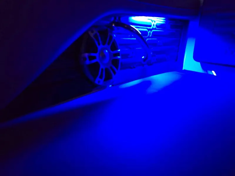 Slide: The Image of 2025 Sea Ray SPX 210 BR interior with blue LED lighting. - 27