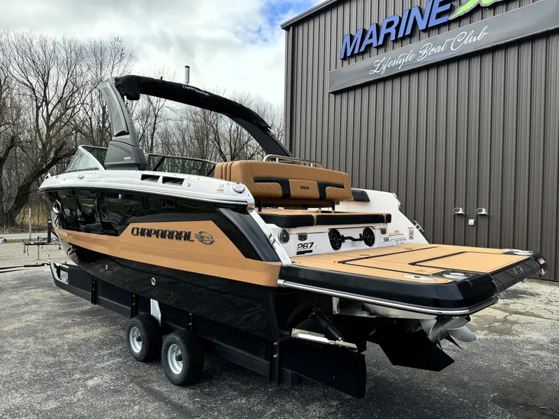 Slide: The Image of 2025 Chaparral 267 SSX boat on trailer at Marine boat club. - 2