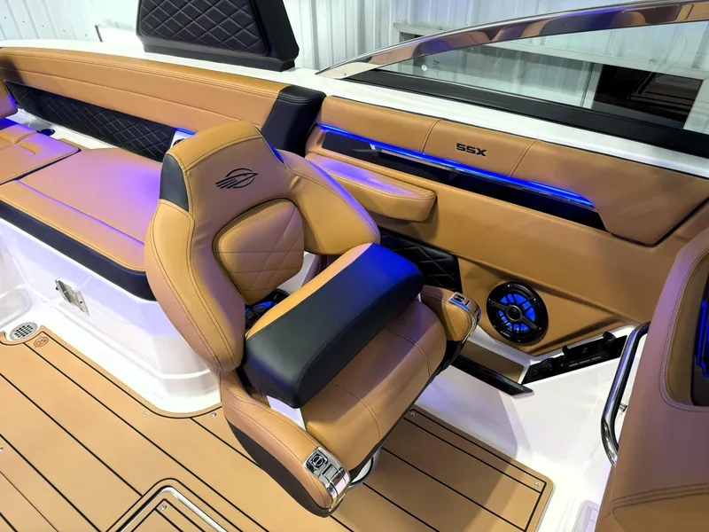 Slide: The Image of Luxurious interior of 2025 Chaparral 267 SSX boat with tan leather seating and modern design. - 6