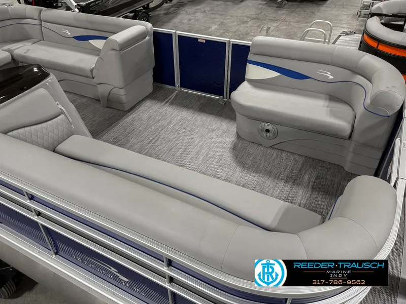 Slide: The Image of 2023 Bennington 208 SL pontoon boat interior with gray seating and blue accents. - 13