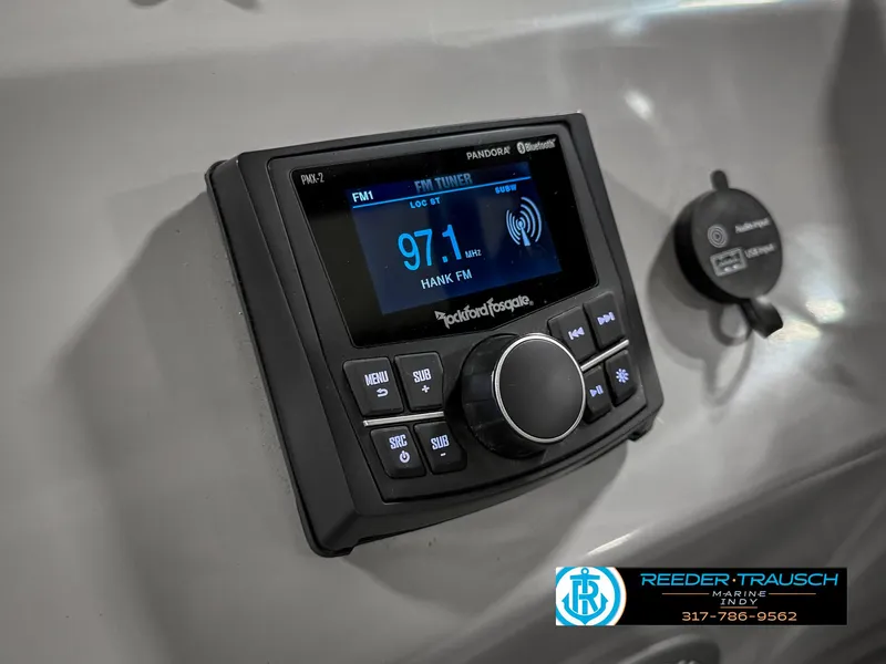 Slide: The Image of 2023 Bennington 208 SL stereo system with Bluetooth and FM radio display. - 32