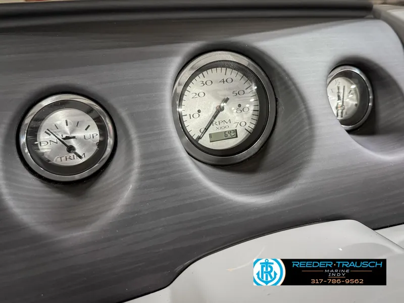 Slide: The Image of Dashboard gauges of 2023 Bennington 208 SL boat, featuring RPM and trim indicators. - 34