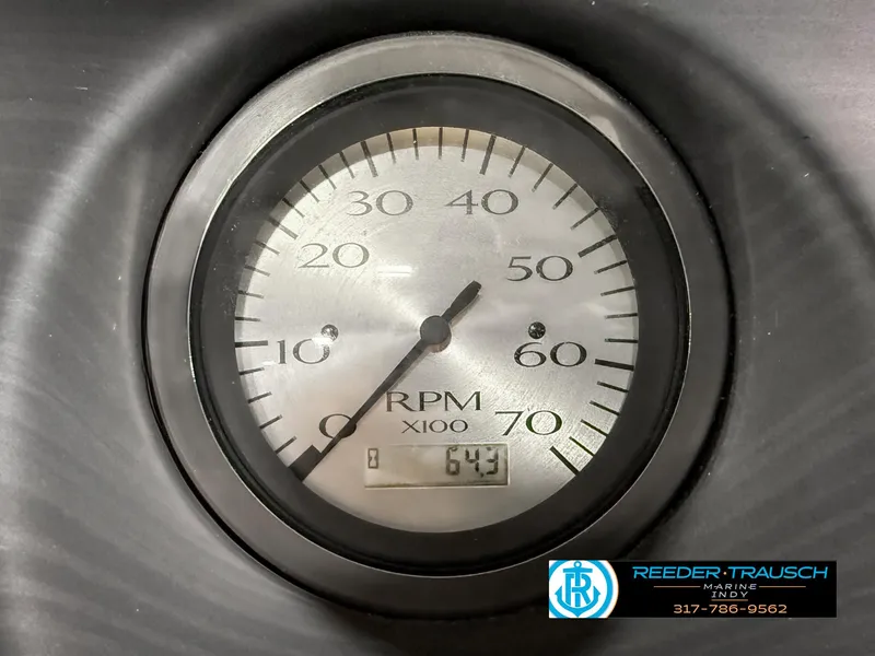 Slide: The Image of Tachometer of 2023 Bennington 208 SL showing 643 RPM, Reeder-Trausch branding visible. - 35